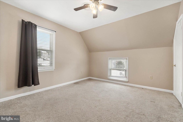 bonus room featuring light carpet, vaulted ceiling, and ceiling fan