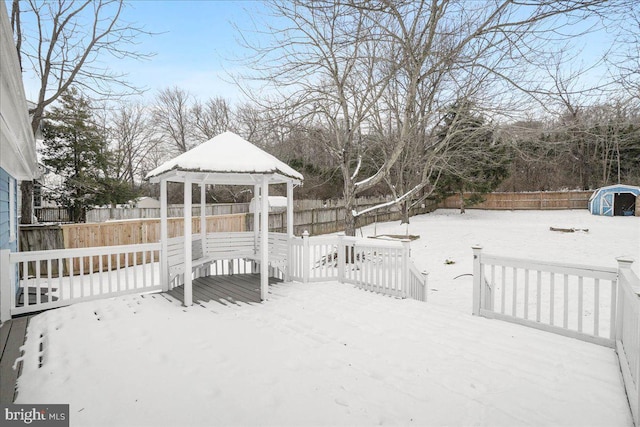 snow covered deck featuring a gazebo