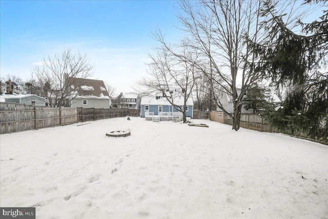 view of yard layered in snow