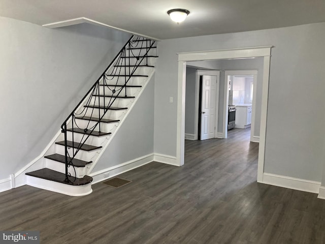 staircase featuring hardwood / wood-style floors