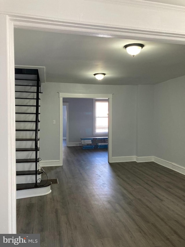 spare room featuring dark hardwood / wood-style flooring