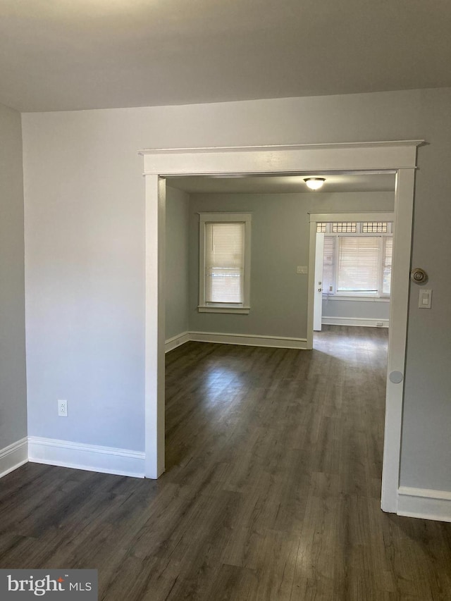 spare room featuring dark hardwood / wood-style floors