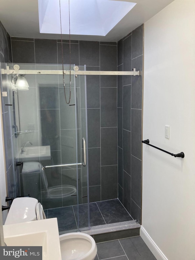 bathroom with toilet, tile patterned floors, and an enclosed shower