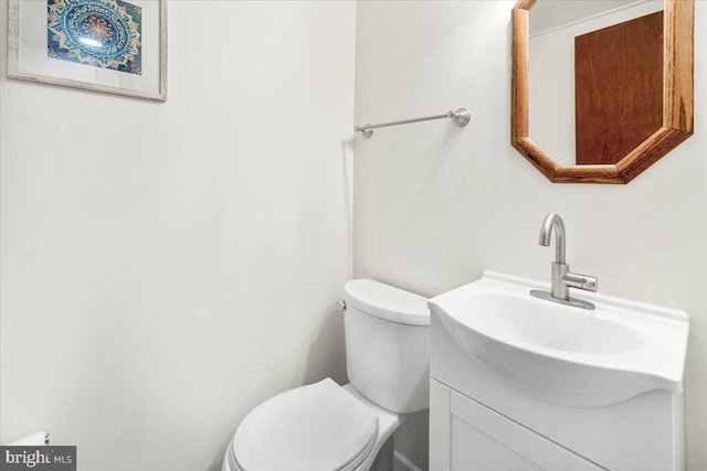 bathroom with toilet and vanity