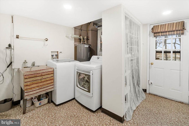 laundry area featuring electric water heater and washer and dryer