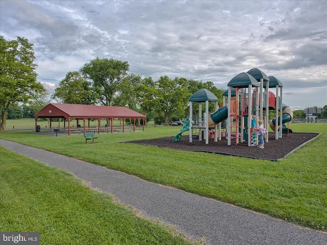 view of jungle gym featuring a lawn