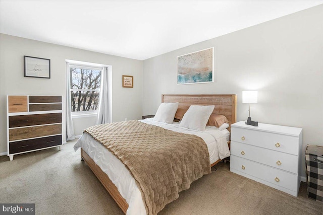 bedroom with light colored carpet