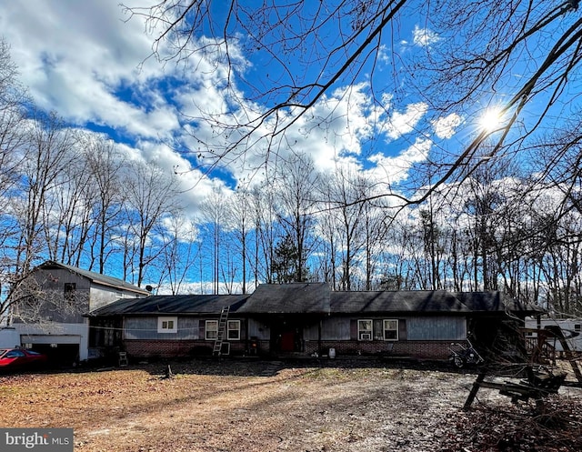 view of front of property featuring brick siding