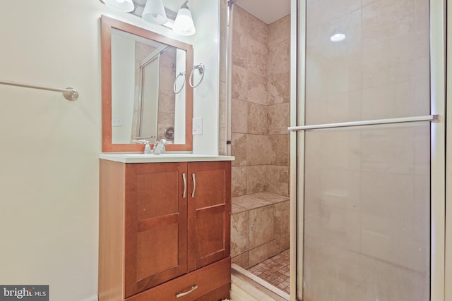 full bathroom with vanity and a shower stall