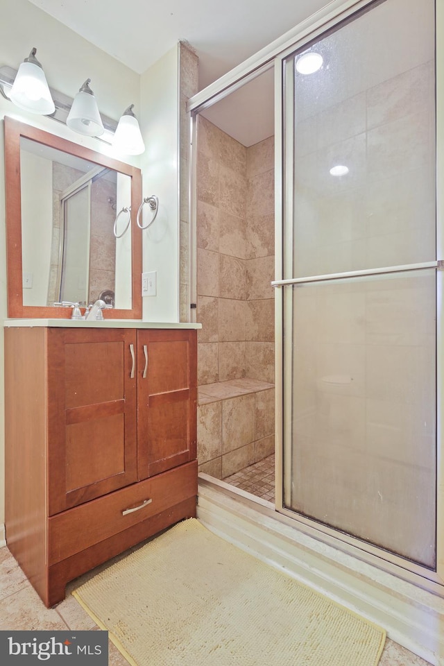 bathroom featuring vanity and a stall shower