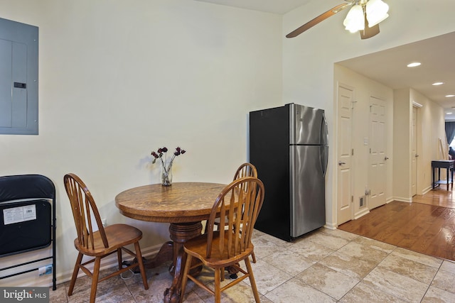 dining space featuring electric panel, baseboards, ceiling fan, and recessed lighting