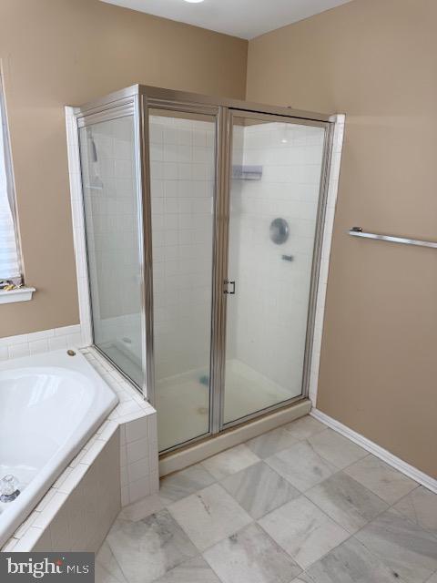 bathroom with independent shower and bath