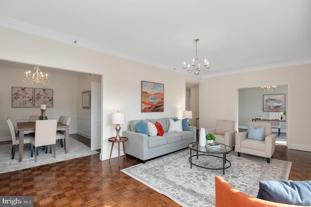 living room featuring dark parquet flooring, a notable chandelier, and crown molding