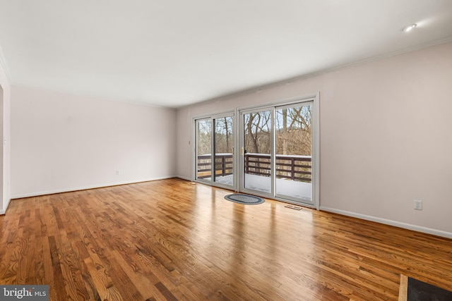 unfurnished room featuring wood-type flooring