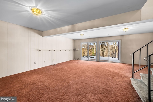 interior space featuring wooden walls and a notable chandelier