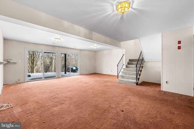 unfurnished living room featuring carpet