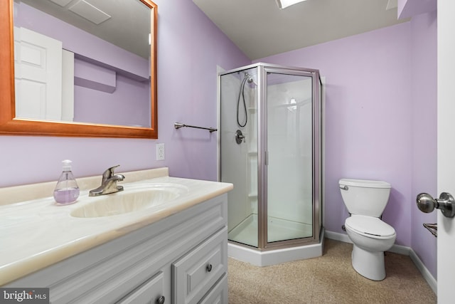 bathroom with vanity, toilet, and an enclosed shower