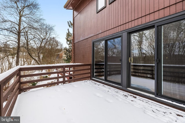 view of snow covered deck