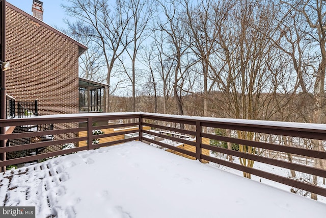 view of snow covered deck