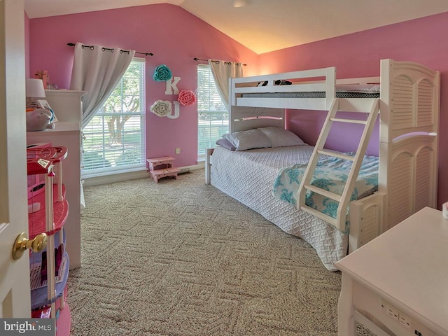 bedroom featuring vaulted ceiling and carpet