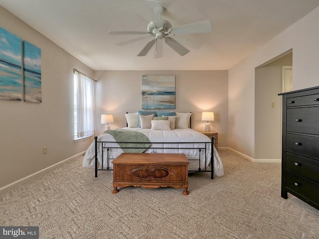 bedroom featuring light colored carpet and ceiling fan