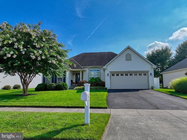 view of front facade featuring a front yard and a garage