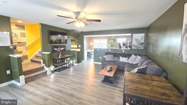 living room featuring hardwood / wood-style flooring and ceiling fan