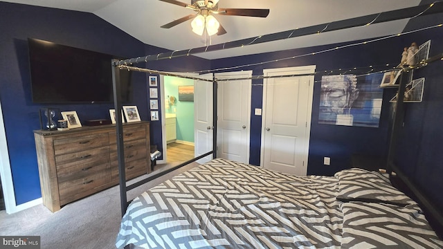 carpeted bedroom featuring ceiling fan and lofted ceiling