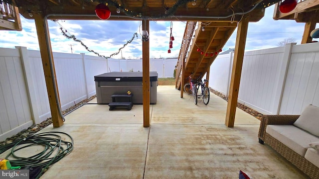 view of patio / terrace featuring a hot tub