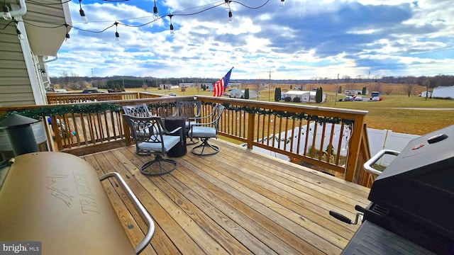 wooden deck with area for grilling