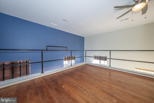 empty room featuring hardwood / wood-style flooring and ceiling fan