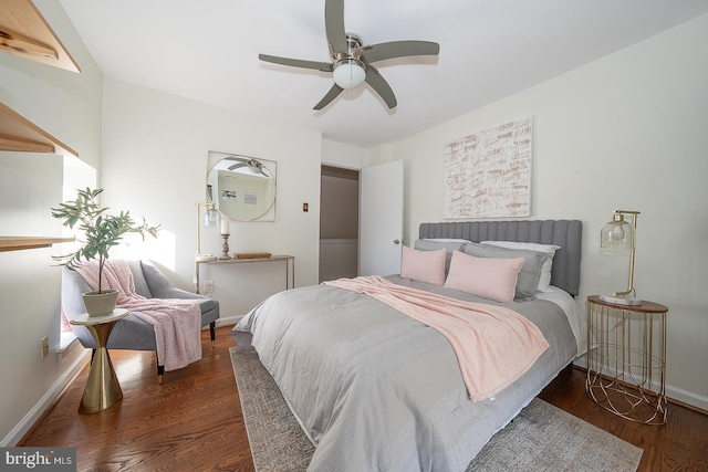 bedroom with ceiling fan and dark wood-type flooring