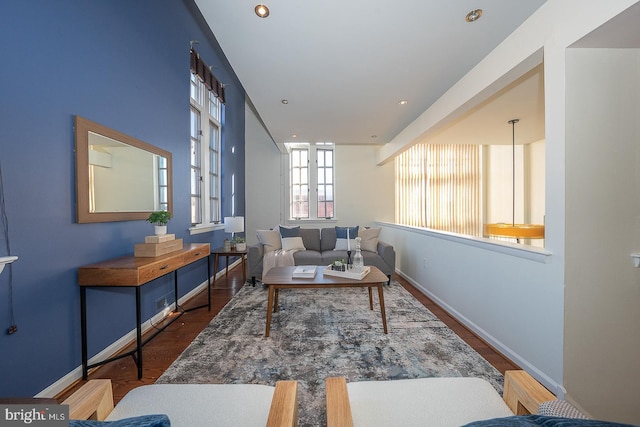 sitting room featuring dark wood-type flooring