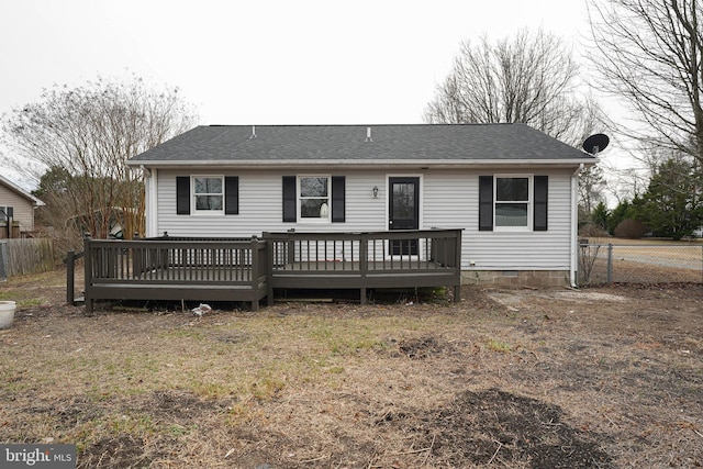 rear view of house featuring a deck