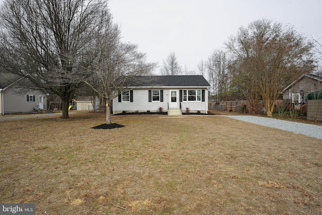 ranch-style house featuring a front lawn