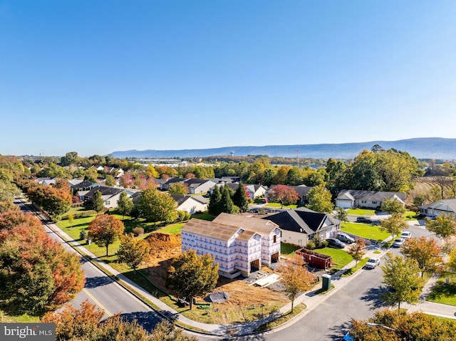 birds eye view of property featuring a mountain view