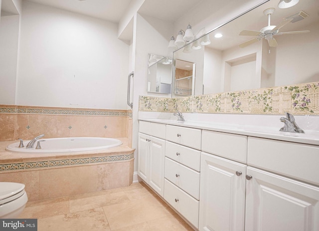 bathroom featuring vanity, ceiling fan, tiled tub, tile patterned flooring, and toilet