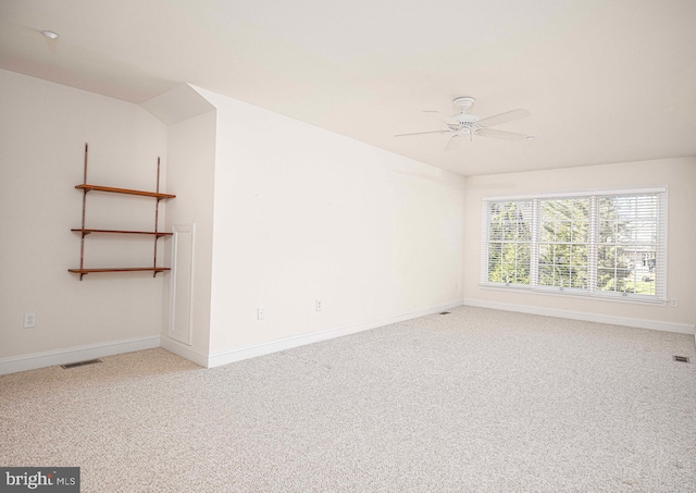 empty room featuring carpet flooring and ceiling fan