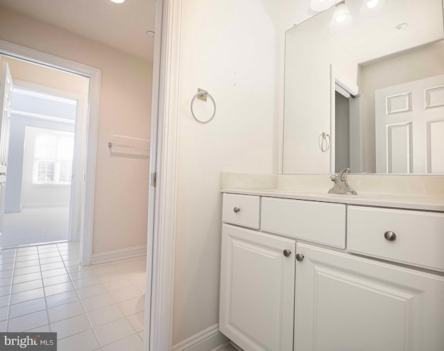 bathroom with tile patterned flooring and vanity