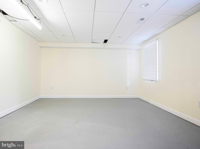 basement featuring a paneled ceiling