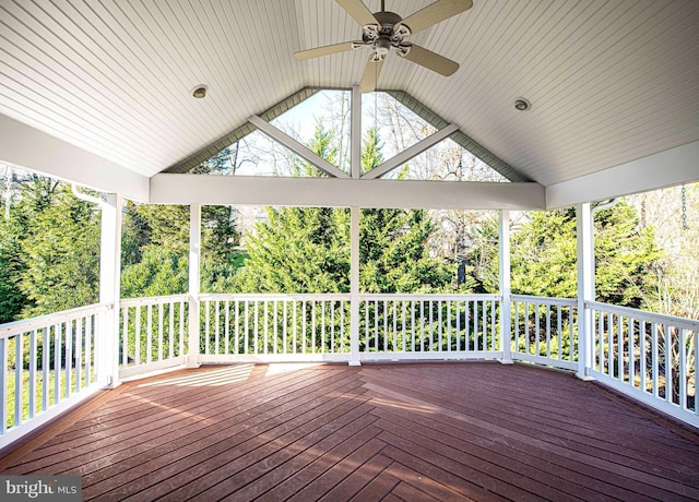 wooden deck featuring ceiling fan