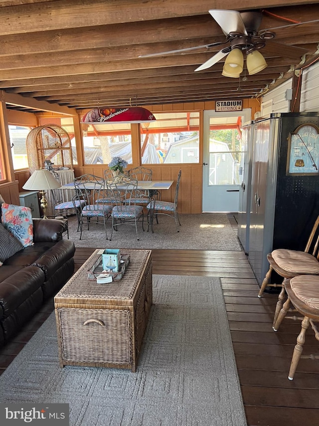 living room featuring hardwood / wood-style floors and ceiling fan