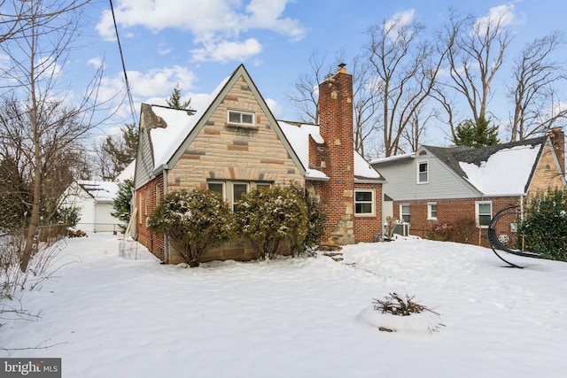 view of snow covered house