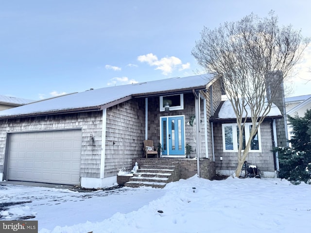 view of front of property with a garage