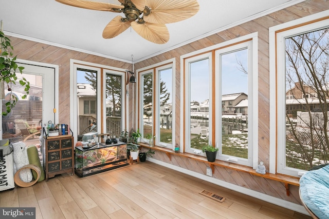 sunroom / solarium with ceiling fan