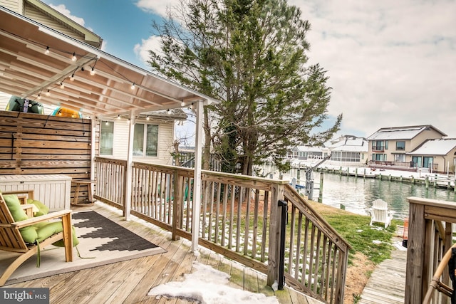 wooden deck with a water view