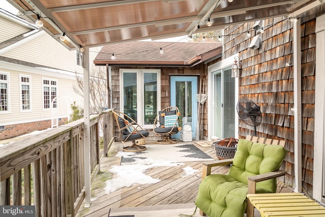 wooden deck with an outdoor fire pit