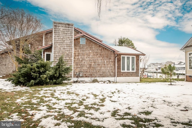 view of snow covered property