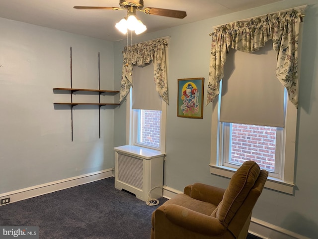 sitting room with carpet and ceiling fan