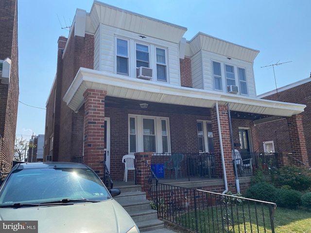 view of front of home featuring cooling unit and covered porch